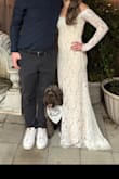 I absolutely loved this dress for my engagement party! The lace is stunning and the attention to detail was incredible! I received so many compliments and it was the first time I truly felt like a bride which is so exciting as I start planning my wedding! I did have to have it hemmed as it was a tad bit too long but I am 5'4". The overall fit was perfect though! - Olivia G.