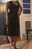 This dress is more beautiful in person. I have curves and was worried a medium wouldn't fit. So glad I got the medium. It's very slimming. Hides all the insecurities I have. Definitely get this dress! - Gina B.