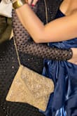 This clutch complete my outfit so beautifully. All my accents were gold so it fit right in. It's also very durable, it was not flimsy or cheap-like. - Bre A.