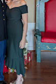 I could not believe how perfect this dress was. The material was thick and well-made. It had just the right amount of stretch and it was shaped already before I ever put it on. That shaping meant that it hugged every curve on my body just right. I needed a little help in the bus area simply because I needed the lift for the dress, but it wasn't anything to do with the dress itself. The color was matte but still had just enough of a sheen to it that it was reflective in pictures. I think my favorite part of the dress was the high low at the bottom. It made this beautiful little kick ruffle in the back which just added a touch of elegance. The dress didn't need any help in that department. I got so many compliments on this. It was absolutely one of the best purchases I've made in a very long time. - Amanda W.