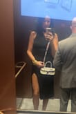 The dress is cute. I do love the neckline. Not super flattering if you have wider hips and the slit is SUPER high. Would have been better for a more casual event. - Julia V.