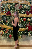 The dress was elegant, and it fit so well. The slit was modest but cute, loved the BOW in front! I got so many compliments. The dress looked amazing with a black fur stole and gold heels. Would definitely recommend the dress and this website to anyone. I've never been disappointed! - Natalie Q.