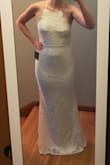 I ordered this dress as a possible bridal dress. It fit a little too loose and felt a little off. The scalloping looked awkward, but that might just be personal preference. The top of the back has an elastic band, which felt sort of cheap and less polished. I didn't find the color to be too dark like some other reviewers. I think it could have been tailored to fit, but I found a better option (also from Lulu's). Definitely worth a try given Lulu's free returns! - Ali E.
