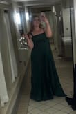 This was the perfect gown for a black tie December wedding! I got so many compliments and felt so pretty. The emerald is truly such a gorgeous color IRL and the pleating made the entire dress look way more expensive than it was (especially getting it on sale). I'm so happy to add this to my closet and can't wait to wear it again! The bow felt a bit too on the nose for my exact circumstance of a holiday-adjacent wedding so I removed it (which was super easy, I plan to keep it as a hair bow). - Emily B.