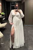 This dress was absolutely perfect! I bought it for my December courthouse wedding ceremony, and I was completely in love with how it fit. The zipper was a little difficult to move at first, but it fit me so snugly and snatched me in at the waist. I received numerous compliments, and some people were surprised that I didn't need to get the dress altered at all! It was slightly roomy in the chest area, so if you have smaller breasts, you might need to get a push-up sticky bra or something. I didn't wear a bra with it and was mostly fine, just had to scoop them back up every so often. The sleeves never fell off my shoulders, and it was very comfortable to wear. Without heels on, the dress was about floor length (I'm 5'10"), but with kitten heels, it was about an inch or two off the floor. I would absolutely recommend it! - Brooke T.