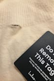 I ordered a size up, but the sweater was so tight. It wouldn't even stay off the shoulders, and it also had a hole in the neck. Very disappointed. - Michelle S.