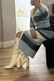 It's a cute, flattering dress, cozy and comfortable for when it's cold. The color does washes out a little after first wash. The in between button space opens in when sitting down. But overall beautiful dress. - Martha T.