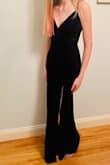 Nice material - heavy, not cheap. Has some give. Beautiful green color. Adjustable straps. Cut is low (especially for a young girl.) Needs a hook and eye. - Kathy C.