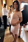 I took a huge risk and ordered this dress for my baby shower outfit. I ordered it in a small instead of an x-small and it worked out perfectly! 30 weeks pregnant but if I were 32 weeks it would be a little too tight. Loved the off the shoulder style and I didn't have to readjust constantly. Fit was not to tight to the body and the material was thick so it wasn't see through. - Sara S.