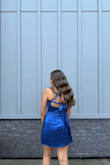 the material is not stretchy, but if you get your size, it should be fine. The back is very cute, and the dress was perfect for my daughter's winter formal - Melissa D.