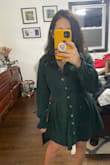 I purchased this corduroy dress to compete with one I bought from ASOS. I must say, it was stiff competition. This one had pockets, not very thick material (I would have liked thicker, but it was fine), pretty color, decent quality, and good structure. I ended up keeping both. No regrets. The color makes it really nice for December. - Christina G.