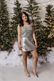 This top (and metallic silver skirt shown on model) looks as perfect in person as it does online! Size up though!! - BriAnne B.