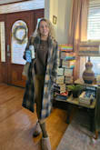 It's a light jacket, but that's perfect for fall and my southern winters. I also love the length! I ordered a size small, and it fits perfectly. I can even fit a sweatshirt comfortably underneath. I'm 5'2" & 115lbs. - Stacey B.