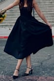 This is my favorite dress. Fits great, feels good (the corset is amazing), the material is shiny which enhances its black color and looks super elegant in black heels. I love it! - Lyn G.