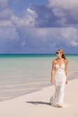 Bought for my very small beach wedding in Turks. It was perfect! Very well made for the price. It ran very long, so I had it cut and a bustle option. Highly recommend! - Kellie T.