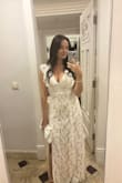 Loved this dress for my rehearsal dinner. I also brought it on my honeymoon. Fit perfectly, even the length. Did not need any alterations. Does have a low cut V. Super cute, would recommend! - Devon M.