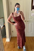 This dress is definitely worth the price. It's so soft, stretchy, and flattering. The shape is stunning. I'm not a huge fan of the rust color, but my friends really like it. It's sort of a muted/light red in person. I absolutely love the dress and highly recommend. - Heather D.