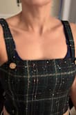 Fit perfectly. I had a wide but small chest and medium worked well. I wore this to work with a black long-sleeved shirt for a more modest look. - Ana Y.
