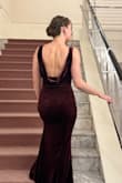 Gown fit my daughter to a tee.  Wore to the Nutcracker.  Lots of compliments.  She could wear xs and small but preferred small so she could enjoy dinner and breath easier!  

Velvet material was wonderful and didn't need any slip or lining. - Rachel M.