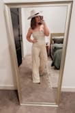 This jumpsuit is everything. I wore it to my company Christmas party in the Fort Worth stockyards. The fit is incredibly flattering, and the style is stunning in person - photos honestly don't even do it justice. The fabric has just the right amount of structure while still being super comfortable, which made it easy to wear all night long. I am tall and have an athletic build and I did size up because I wanted to make sure it wasn't tight or pulling, and I'm glad I did. The bottom fit exactly like I wanted it to, though I could have gotten away with my normal size, large. The top was slightly loose on me, but it still worked beautifully and didn't take away from the overall look at all. I got compliments all night and truly felt like a model wearing this. Chic, confidence-boosting, and comfortable is a rare combo, but this jumpsuit nailed it. Lulus has my heart forever. - ReShea L.