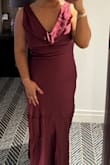 Loved this dress when I first put it on! It is more form fitting in the top and then lets out as it goes to the bottom. For the price the quality was top tier and felt very good in it! - Mya S.