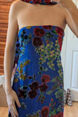 This dress is a beautiful, vibrant fabric, true to the photo. I first ordered a Small (pictured), which is skimming through the body, but was very loose in the chest unless I was projecting my chest and wearing a textured bra with tape. I wear a true 4 and have a larger ribcage, and the Small size chart says it should fit a 2-4. The small was still too big for me, so I would say it runs large, closer to a true 6. The small skimmed the floor by about a 1/2".
Then I ordered an XS, which zipped and was tight/fitted around the waist, but the tightness around the bust pulled my breasts down and flattened me. Not a flattering look. I never ever wear XS, though, so I would still say it is slightly large since I technically could wear it. I would say the XS would fit a true size 2. The XS was a good 1 1/4" off the ground for me. - Jessica K.