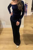 This dress is incredible! I purchased it for a winter wedding. The velvet texture & navy blue color were perfect! It's so soft, the color is super rich. I received so many compliments. I followed the size guide and ordered a large. It fit like a glove. I was very comfortable, but it fit snug like I wanted. The slit and exposed shoulder are the perfect amount of sexy. The ruching in the mid section is another great detail I loved. I'm excited to have this in my closet, but I would easily purchase this again! - Mariana C.