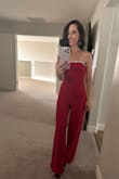 This jumpsuit fit perfectly. I was able to wear it with a strapless bra. The stones around the bust area really elevate it. It's long but needs to be worn with heels anyways, so it was good. - Karissa P.