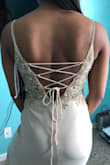 When It came in the mail it was heavy and made of thick good quality material. I thought it was going to be thin and lightweight but you can tell it's made to hold well. I'm wearing it for my prom coming up next month but i've already tried it on 3 times. I feel I sized up because I was nervous to get a size down and it would be too small but honestly it still fits amazing. I'm just getting it altered to be a tad tighter and shorter but overall i'm really happy with it - Jade J.