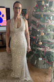This dress fits like a glove! I love every detail about it. It is stunning, classy and fits the body without being too tight. I had originally gotten the small, it fit, but it felt snug.. so I ordered the medium. I couldn't have asked for a more gorgeous dress. Although I will get it hemmed a small bit,  I love everything about it! - Jennifer F.