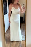 Ordered and wore this for my wedding in January 2026. This dress is simple and clean and was very flattering on my body. I have an athletic frame and felt very feminine in this dress. I did have the straps altered to eliminate the adjustable clip, because I thought they make the dress look cheap. I am very tall (6'0) and the dress was long enough for me, hooray!! The buttons along the back definitely give this dress a higher-end feel. Very very happy with this dress. - Abigail R.