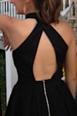 I originally ordered a small but it was huge on me so I returned it got the extra small and it fit perfectly! The only issue was I don't have shoulders (my torso is somewhat short) so there was a bit of extra room under my shoulders/breast area. I cut off the buttons and moved them over a bit to pull it up to fix the problem! I usually have to fix the straps on most dresses so it shouldn't be a problem for you unless you are very petite! I wore this dress for homecoming and absolutely loved it! It was so comfortable and I felt so confident I can't wait to wear it again!!
(tip: wear a sticky bra) - Olivia S.