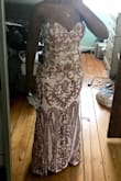 This dress is absolutely GORGEOUS! It fits perfectly, only downfall is the sequins scratched my underarms, so that's uncomfortable. I'm wearing it to a wedding in a few days and I've decided that the scratching is worth it since it's so pretty. - Maureen A.