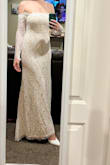 While it is a very beautiful dress, it was a little ill fitting on me. I think my larger bust was a bit of an issue for the fit. The dress was quite short with the height of shoes I plan to wear for my wedding, as well as limited mobility in the arms. The second photo is all the higher I could lift my arms. That being said, the lace is beautiful. I was pleasantly surprised at the quality. Definitely someone's dress, just not mine. Unfortunately, I will be returning. - Mikala G.