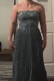 This dress is very beautiful, and the material is light and airy, exactly as described. Unfortunately, I ended up returning it because the bust did not fit well. I am a 34B, and even with the elastic meant to keep it up, it kept slipping down, making the bust look flat and creating an unflattering fit under the arms. I was disappointed because I really loved the fabric and overall look, but the fit just didn't work for me. - Tressa R.