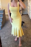 I have this dress in black as well. I can wear this bra less at a 32G. It's lemon and it's stunning. I love it! Fits like a glove, if you are going to wear Spanx, be sure they're pretty incognito- it may show through. I can see my thong line through it. - Christall A.