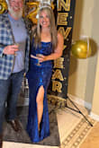 The dress was beautiful and fit well. The skirt was very long. I'm 53 and wore 5 inch heels, and it still touched the floor. The sequins were very scratchy and dug into my leg where the slit was. - Becky K.