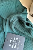 I would really like to love this sweater top, but it arrived with a large hole under the armpit. Even though it doesn't qualify for an exchange, are you willing to make an exception since it arrived defective (and still has the tags)? - Alissa K.