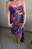 This dress is unique and fun. I got so many compliments on it! It's a very flattering fit as well. Probably my favorite dress. I would normally wear a M, but got a L in this dress, and it fits perfectly. - Gina S.