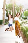 I wore this with a high waisted flowy skirt to Coachella and it was a dream. Super flattering and comfortable. I highly recommend it. It fits a little longer than a crop when your arms are down. - Breanna T.