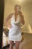 I'm so excited to wear this on my Bach party and my honeymoon. I got a size medium, and yes, it can be low in the chest, but I am getting clothing tape so it stays in place! So cute with heels. - Kathleen G.