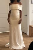 It's a very elegant dress. I ultimately didn't pick this one because of how tight the shoulders are. My sister helped me put it on, and the zipper is on the side of the dress; you have to lift your arm to zip it. A bit uncomfortable to do so, but very pretty nonetheless. - Joseymi D.