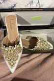 The shoes came in just like the picture. The main pearl on one of them fell off right away, but I'm just gonna hot glue them on. They fit like slides, so not great for running errands, but I'm just wearing them during my wedding ceremony so it's perfect! - Julie M.