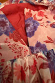 The dress is lightweight, and the color is very pretty. However, there were three issues that disappointed me. First, the dress arrived with a torn side seam. Second, the adjustable straps do not stay in place because the material is very thin and slippery. Third, the zipper feels weak and gets stuck around the waistline, and I am afraid to move it up or down because it already looks like it's going to break. Unfortunately, the dress was final sale, so there isn't much I can do at this point. - Jina N.