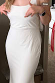 I bought this for my rehearsal dinner. Originally ordered the small. I could barely zip it and looked pregnant. I exchanged it for a medium and the medium is way too big and feels like lower quality material. The top part is almost sheer and the whole look is saggy, especially the bow in the back. Probably too discouraged to do another return. Medium is pictured. - Ava D.