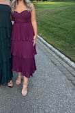 This dress was super cute, loved the deep purple color and the tiered bottom. I wore it to a wedding in early September that was semi formal. The top was very supportive with adjustable straps. - Aubrey H.