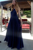 The material of this dress is very good quality. The skirt is very flowy and sort of heavy, which adds the princess feeling I have on this dress. The length from the medium to the small is slightly shorter. I still loved it and it reached the floor with 3 inch heels on. I'm going to try to get it in red forgot this year. - Kate W.