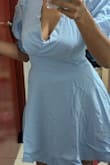 I think it's an okay dress. The color suits my skin, but the front part feels like it's not right. That makes me feel uncomfortable. It's like a pouch. That's what I didn't like. I had higher expectations of the dress, but it didn't meet them. - Yesenia Q.