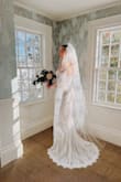Fell in love with this dress the second I put it on. Cancelled my bridal salon appointment and ran with this one! I did have a winter wedding, so I found lace sleeves elsewhere to add on, and it was a dream come true. - Nickole B.