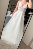 This dress is really pretty! I decided not to keep it just because the style isn't what I want anymore. The quality of the dress and materials is nice. The corset back allows you to easily tighten and adjust the bust and straps. I'm 5'4 and ordered the XS. It was a bit long and big on me, but I could see it being easy to alter. The top is pretty sheer, but I don't think a bra is needed, though there isn't much support, so you might want to add or wear something underneath, depending on how much cleavage you want. - Emily H.